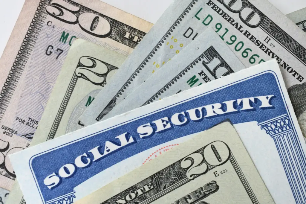Stock image/file photo of a Social Security card and U.S. currency.