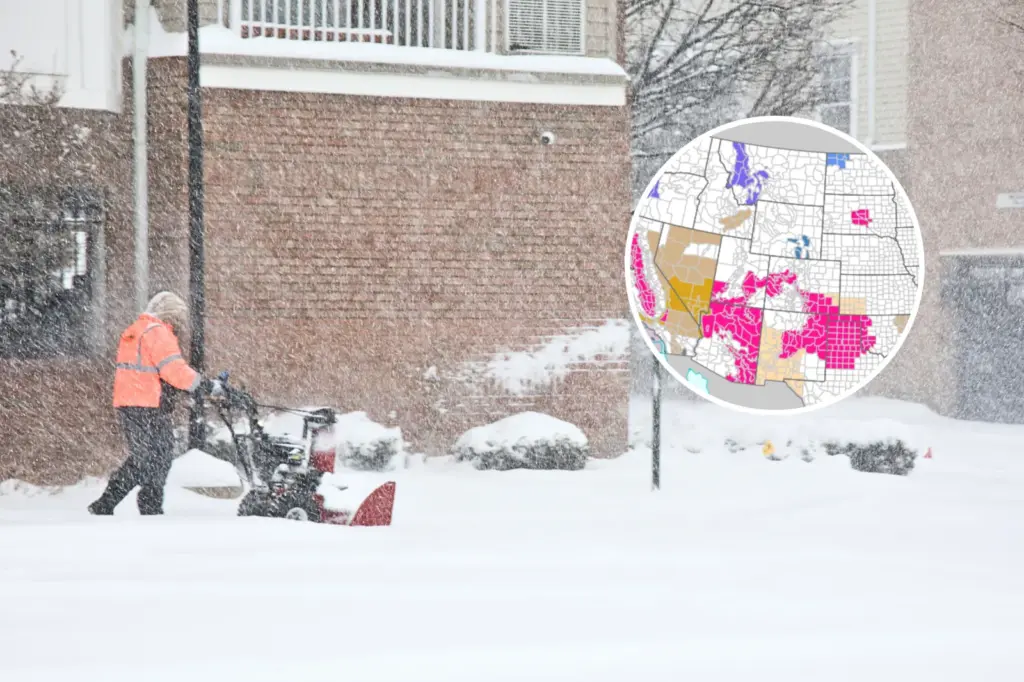 File/stock image: Elmwood Park, New Jersey, USA – January 25, 2026: Man with snow blower clearing snow from walkway at apartment complex in whiteout conditions during a severe winter storm. Inset: NWS map shows impacted areas.
