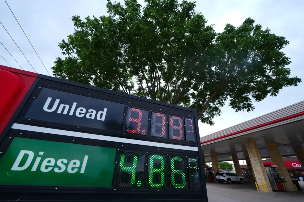 Gas prices are displayed on the marquee of a filling station Friday, May 15, 2026, in Arlington, Texas. (AP Photo/Julio Cortez)