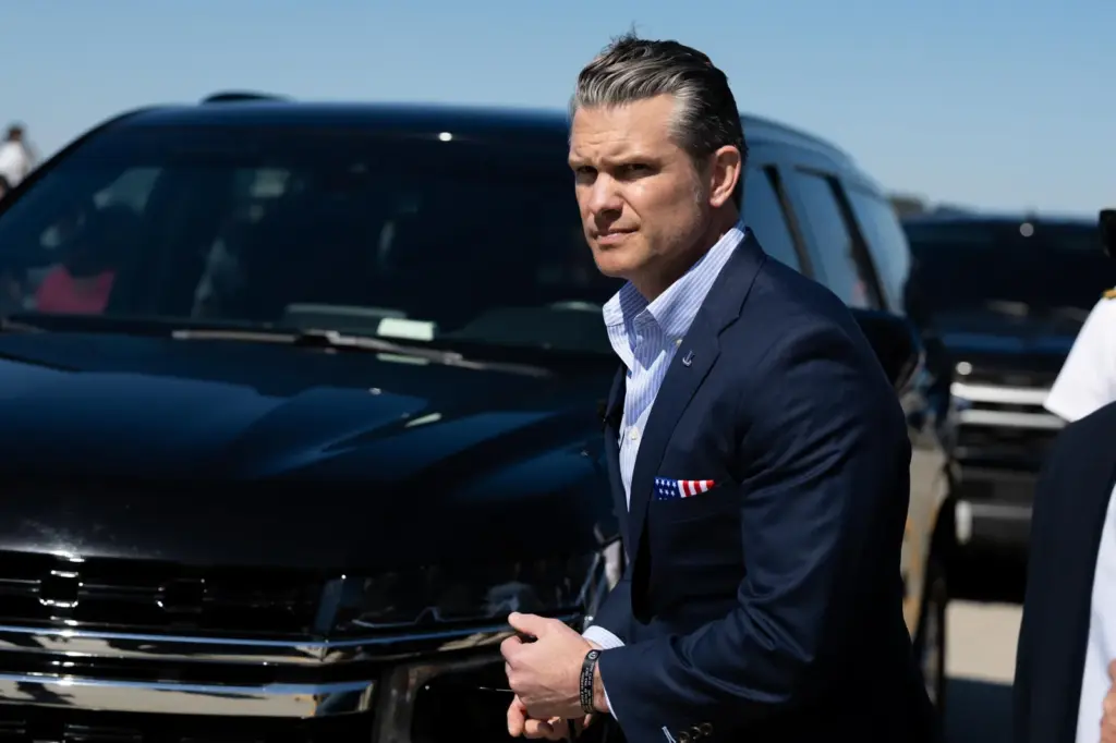 Secretary of Defense Pete Hegseth returns to his vehicle after greeting sailors from the Gerald R. Ford Carrier Strike Group at Naval Station Norfolk on May 16 in Norfolk, Virginia. (Photo by Mike Kropf/Getty Images)