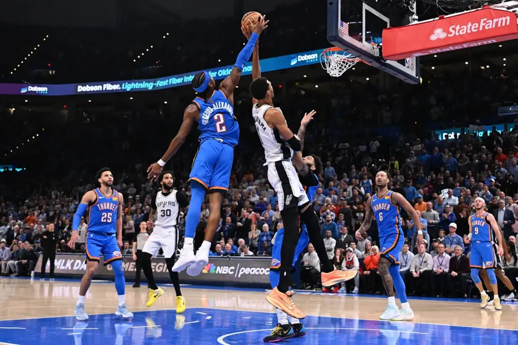 Shai Gilgeous-Alexander #2 of the Oklahoma City Thunder blocks a shot attempt by Victor Wembanyama #1 of the San Antonio Spurs during the second half at Paycom Center on January 13, 2026 in Oklahoma City, Oklahoma. (Photo by Joshua Gateley/Getty Images)