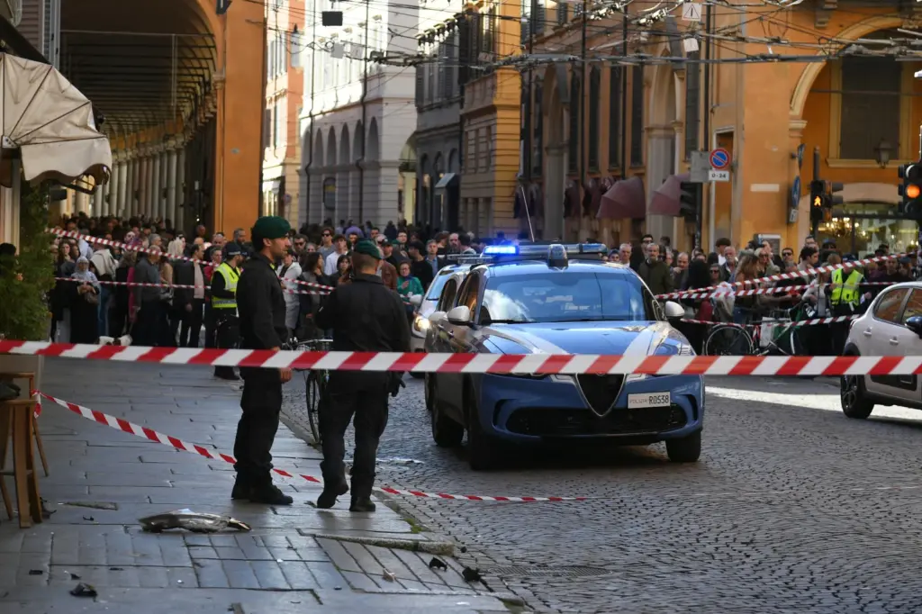 Financial Police patrol a scene after a car incident in a street of Modena, Italy, on May 16. (Lapresse via AP)