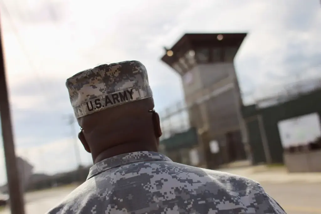 A U.S. Army soldier approaches the U.S. detention center for