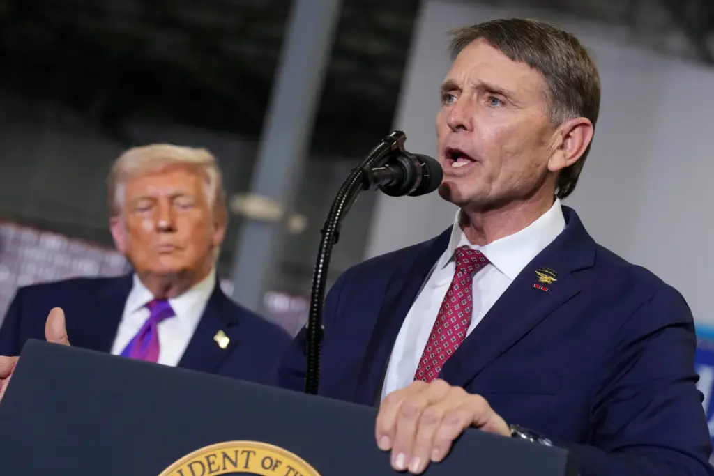 President Donald Trump and House candidate Ed Gallrein speak during an event on March 11, 2026, in Hebron, Kentucky.