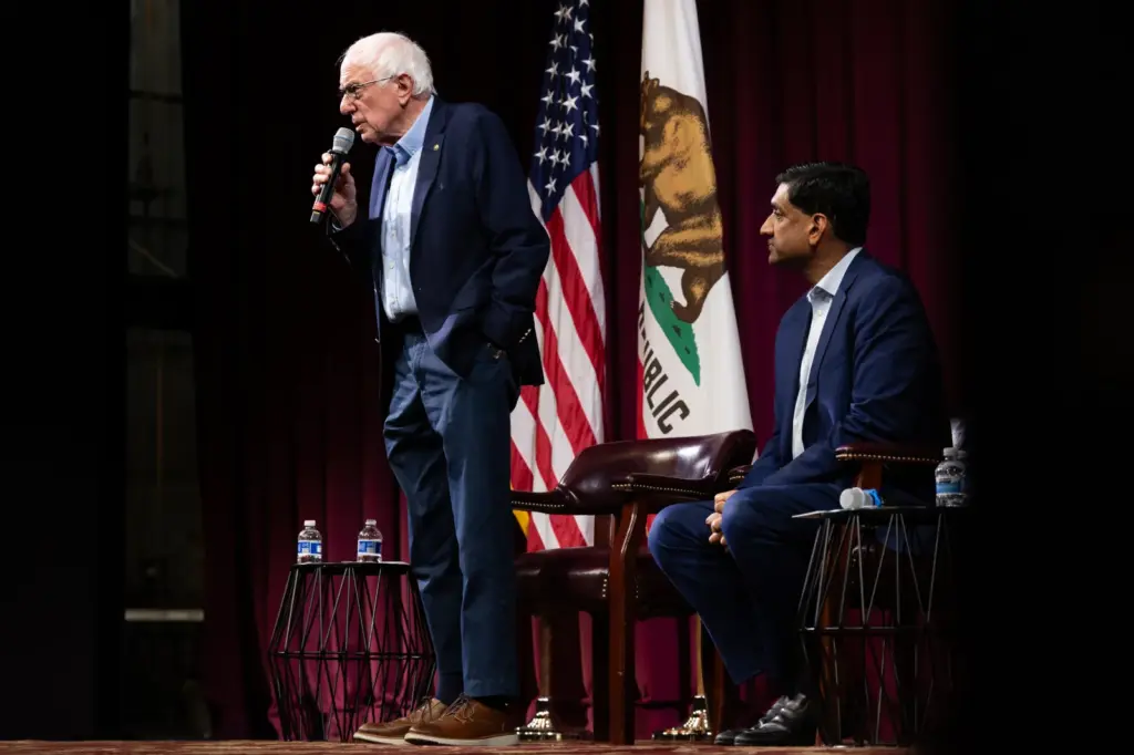 Progressive Senator Bernie Sanders speaks next to Democratic Representative Ro Khanna at a town hall event on February 20 in Stanford, California. The town hall focused on taxing billionaires and the future of AI. (Photo by Benjamin Fanjoy/Getty Images)