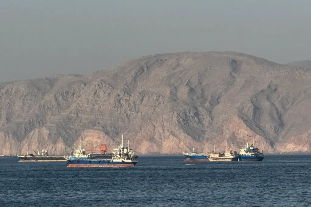 Vessels are seen anchored in the Strait of Hormuz, off the port city of Khasab on Oman's northern Musandam Peninsula on May 17, 2026.