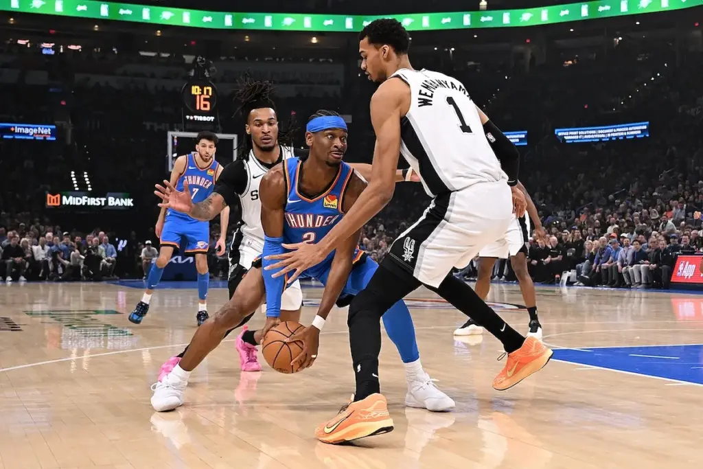 Spurs star Victor Wembanyama guards Thunder star Shai Gilgeous-Alexander in NBA game