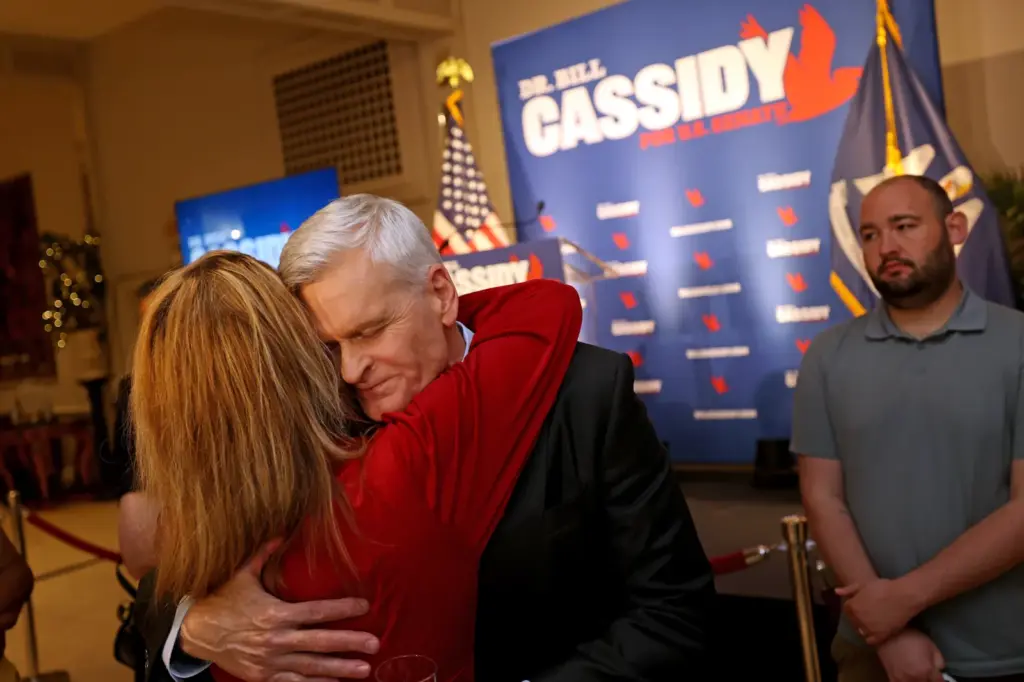 Republican Senator Bill Cassidy of Louisiana hugs a supporter after conceding his primary election contest on May 16, 2026, in Baton Rouge, Louisiana.