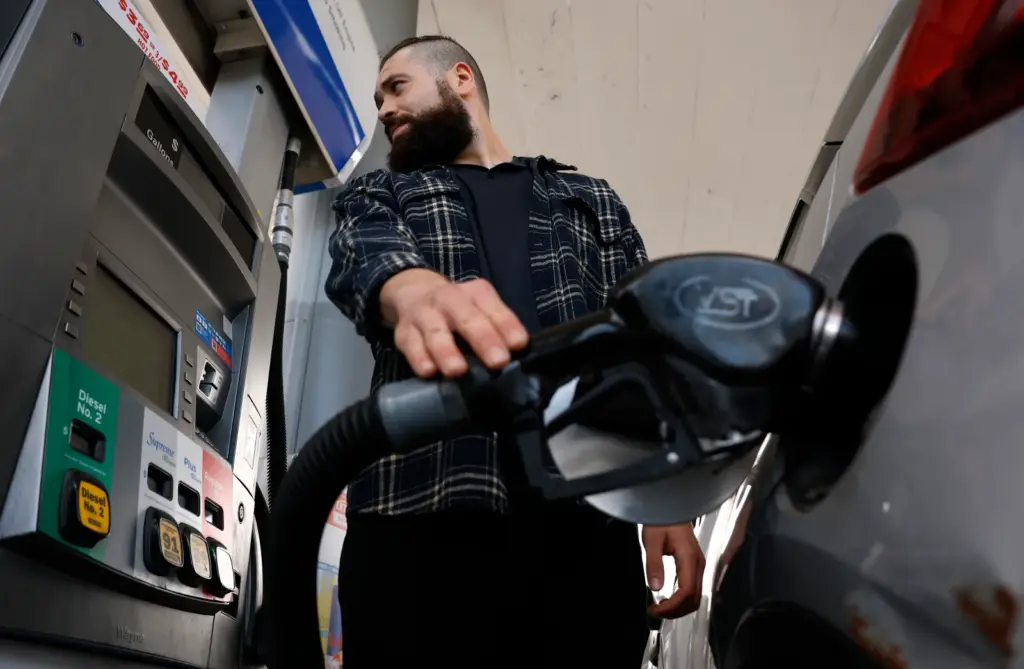 A customer pumps gas into his car at a Chevron station on May 4 in Los Angeles.