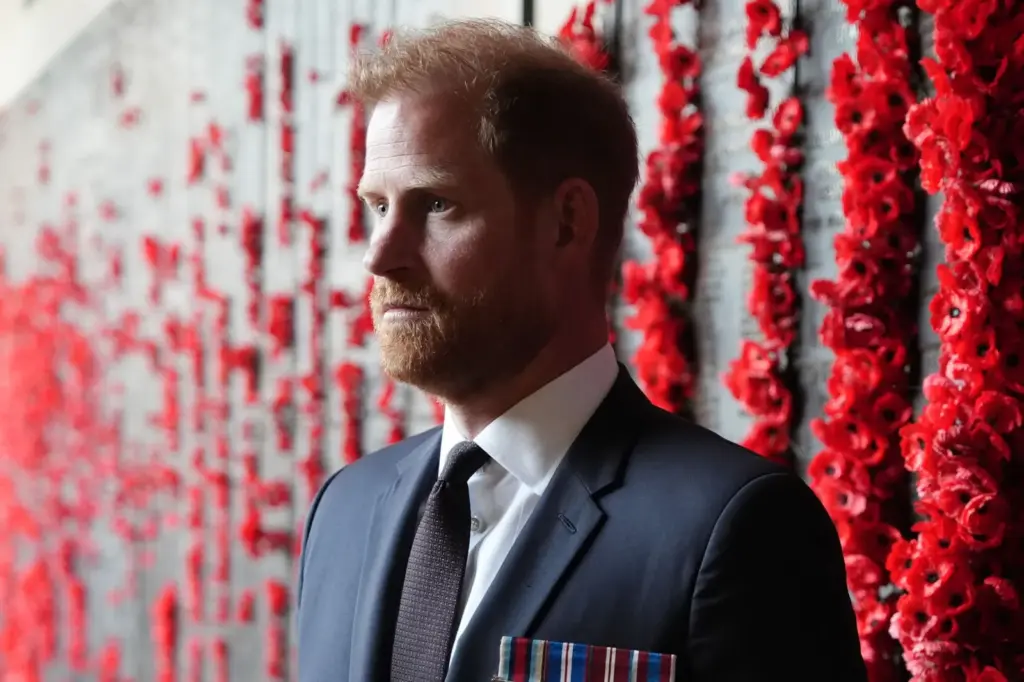 Prince Harry places a poppy in the Afghanistan section of the Wall of Remembrance at the Australian War Memorial, in Canberra, Australia, on April 15, 2026.